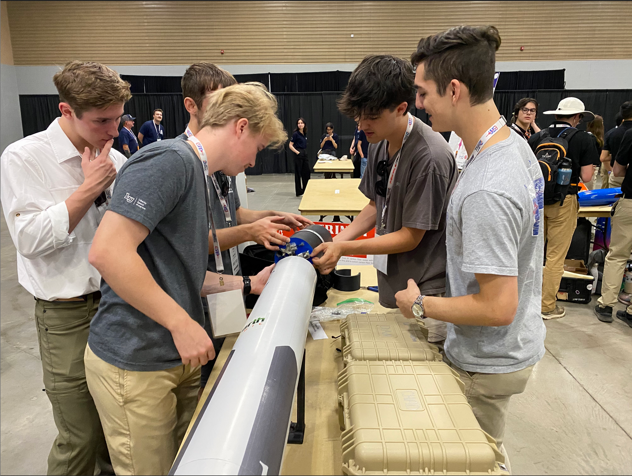 Team members setting up their IREC 2025 showcase.